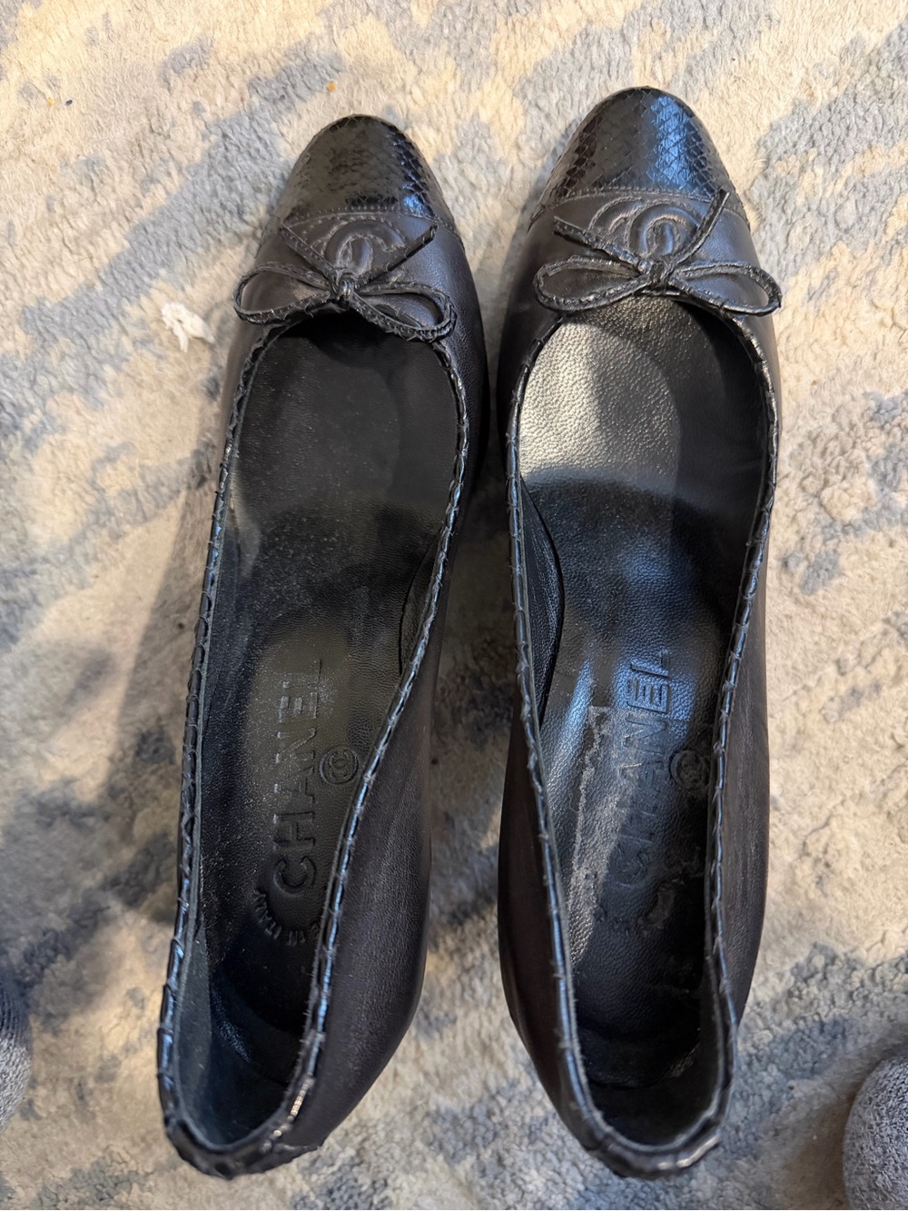 CHANEL Black Leather Ballet Flats with Cap Toe and Bow